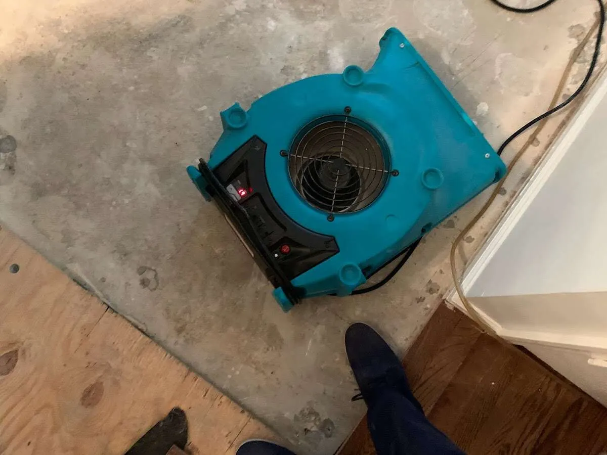 Air mover drying subfloor during Commercial Water Damage Restoration in Temecula